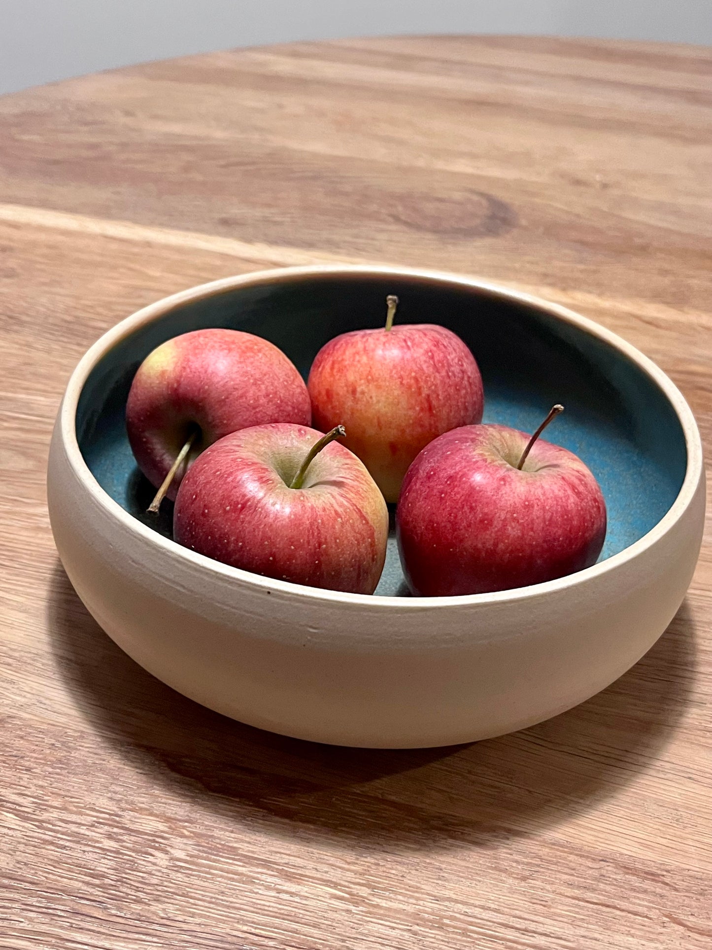 Coupe turquoise tacheté de noir